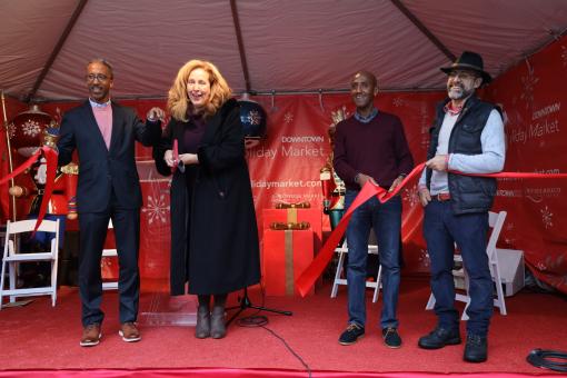 Director Whitfield cuts ribbon at DowntownDC BID holiday market